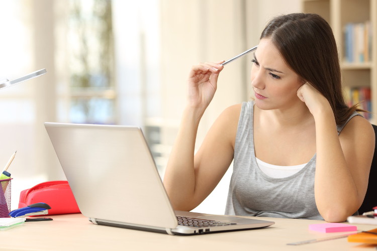 Job seeker concentrating while working on computer