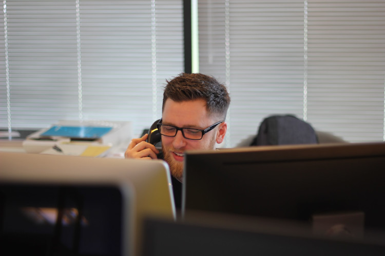 Office worker takes a telephone call