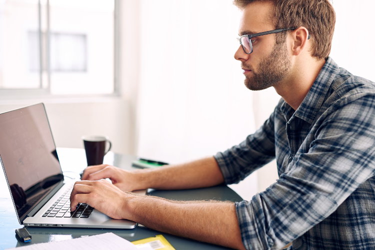 Job seeker typing on computer